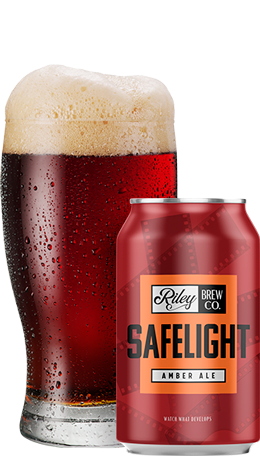 Safelight can and glass filled with beer